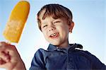 Boy eyeing his ice lolly