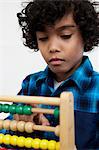 Boy playing with abacus