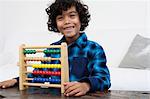 Boy playing with abacus