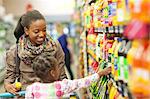 Female shopper and daughter in supermarket