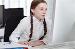 Girl using computer in office