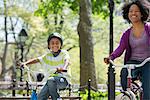 A Family In The Park On A Sunny Day. A Mother And Son.