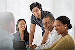 A Multi Ethnic Group Of People Around A Table, Men And Women. Teamwork. Meeting.