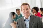 Business Meeting. A Man Smiling Confidently.