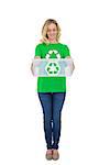 Smiling cute environmental activist holding recycling box on white background