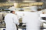 Chefs working in a kitchen at a hurried pace