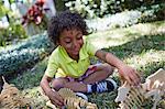 Boy playing with dinosaur skeleton toys