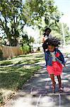 Girl doing hopscotch