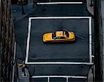 Yellow cab in middle of crossroad, New York, New York State, USA