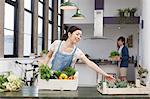 Young couple in kitchen preparing fresh food