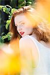 Portrait of young woman with red hair