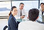 Businesswoman smiling in meeting