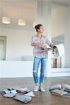 Woman looking at fabric swatches in new house