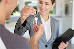 Realtor giving man house keys