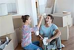 Couple eating Chinese take out food in new house