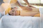 Woman receiving massage at spa