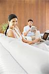 Couple relaxing in living room