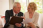 Financial advisor explaining paperwork to woman