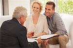 Financial advisor talking with clients