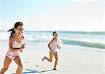 Girls running on beach