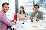 Portrait of business people smiling in meeting