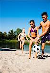 Kids Playing Soccer on Beach by Lake, Lampertheim, Hesse, Germany