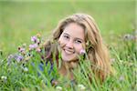 Portrait of Teenage Girl Lying in Meadow, Upper Palatinate, Bavaria, Germany