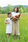 Two sisters with a chicken