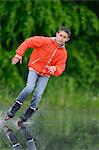 Boy with in-line skates on a rainy day