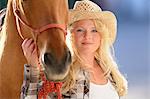 Young woman beside a horse, portrait