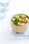 Chicken stir fry with rice in bowl, studio shot