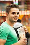 Close-up portrait of young man at amusement park, Germany