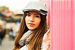 Close-up portrait of teenage girl wearing hat at amusement park, looking at camera, Germany