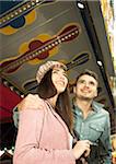 Portrait of Young Couple at Amusement Park, Mannheim, Baden-Wurttermberg, Germany