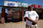Man standing in front of shop, Soweto, Johannesburg, Gauteng