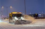 Snow plough at dusk