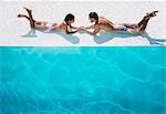 Couple relaxing together in swimming pool