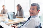 Businessman smiling in office