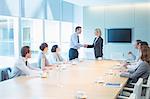 Business people shaking hands in meeting