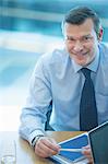 Businessman smiling at desk