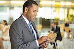 Businessman using digital tablet in office