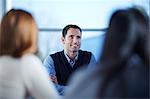 Businessman smiling in meeting