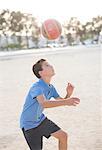 Boy heading soccer ball