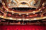 Balcony, seats and ornate ceiling in theater auditorium