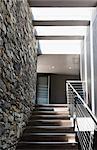 Stairs and stone wall in modern house