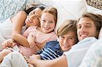 Family relaxing together on sofa