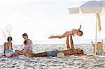 Family relaxing together on beach