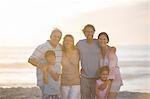 Family smiling together on beach