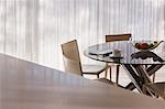 Coffee cup and newspaper on kitchen table