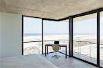 Desk in modern bedroom overlooking ocean